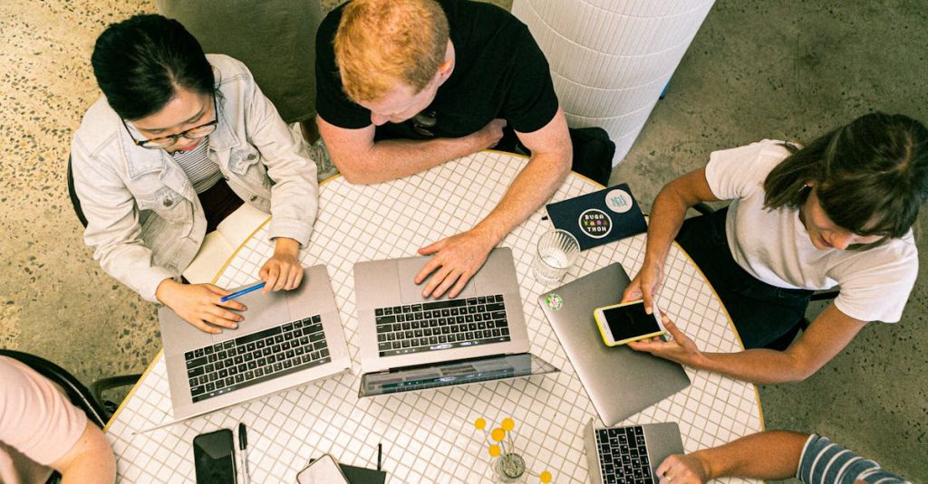 Top view of diverse team collaboratively working in a modern office setting.